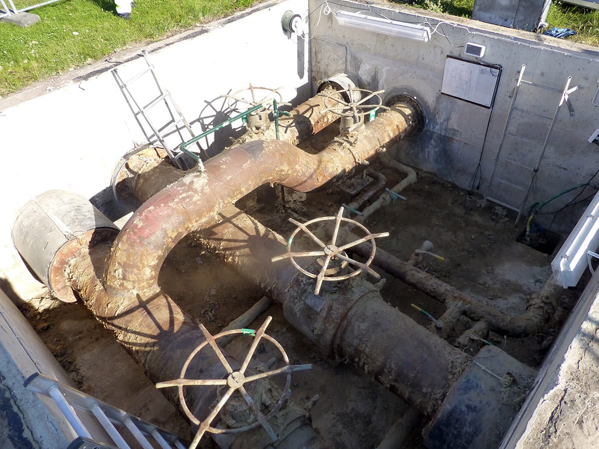 Corroded pipework in a district heating facility