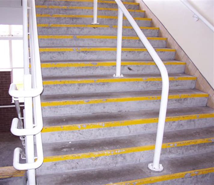 Damaged and worn steps creating slip hazard