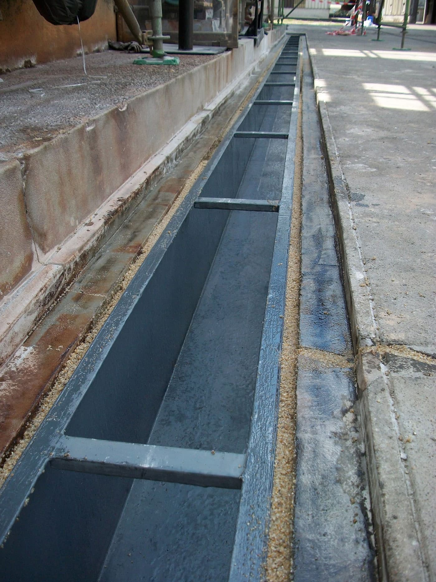 Steel gutter grouted into place with Belzona 4151 (Magma-Quartz Resin)