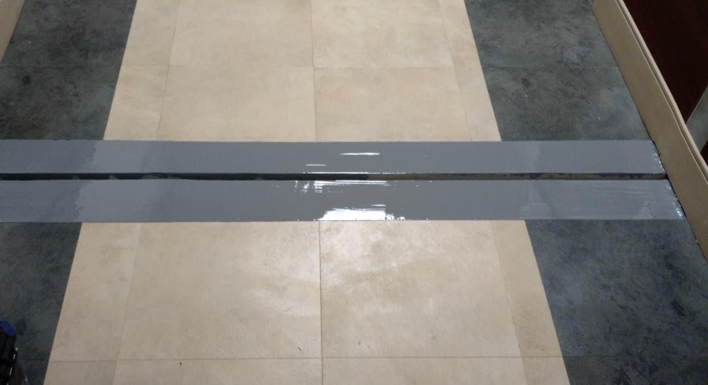 Roof seam and building joint sealed ahead of the liquid membrane