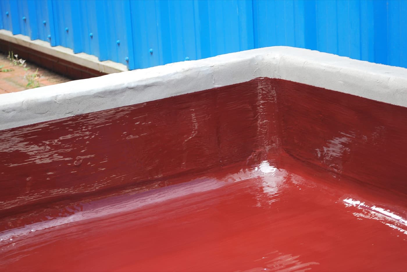 Wet scrubber and ductwork interior lined with a chemical-resistant barrier